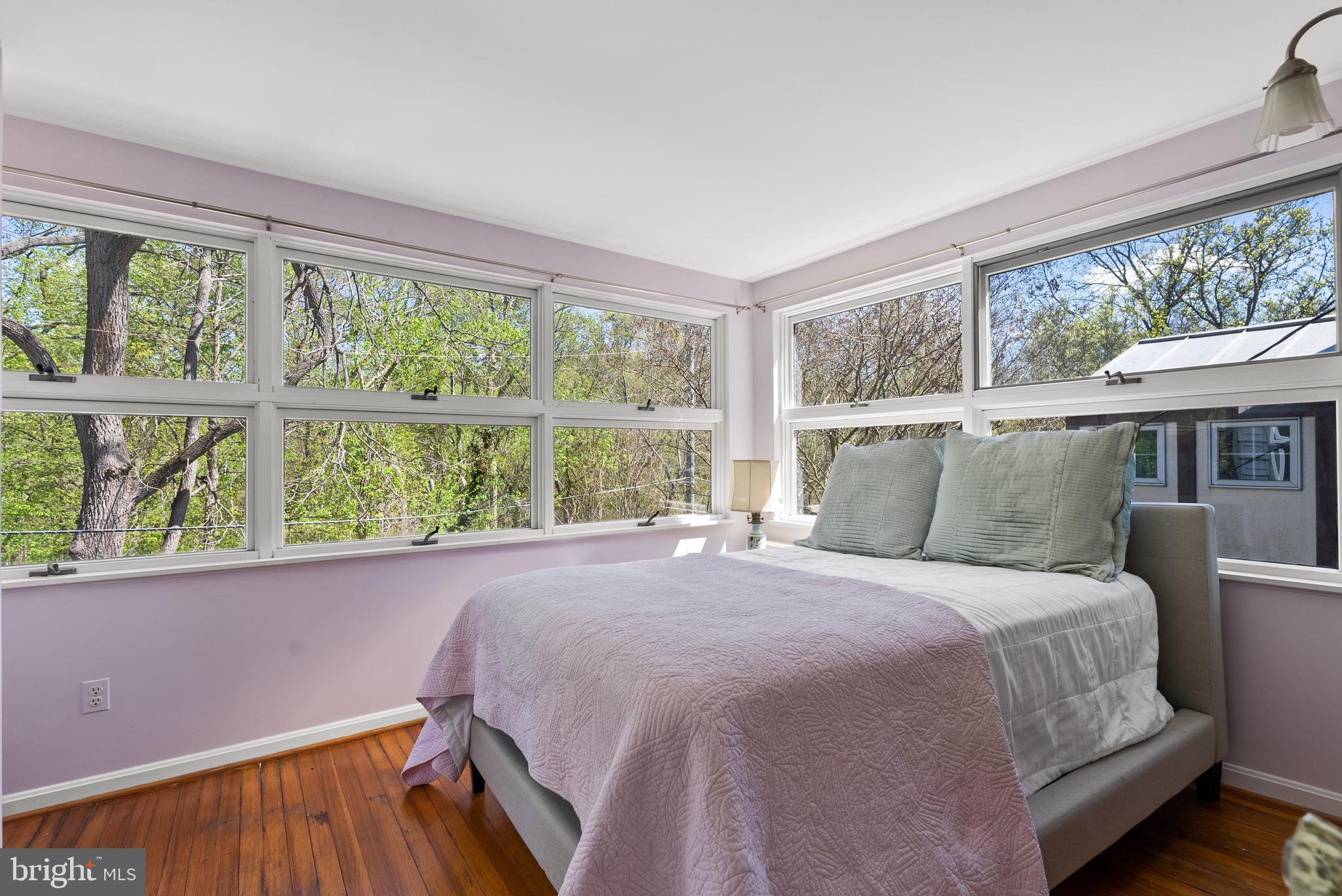 1511 44th Street Northwest Washington, DC 20007 - Photo 23 of 37 a bedroom with a bed and a large window