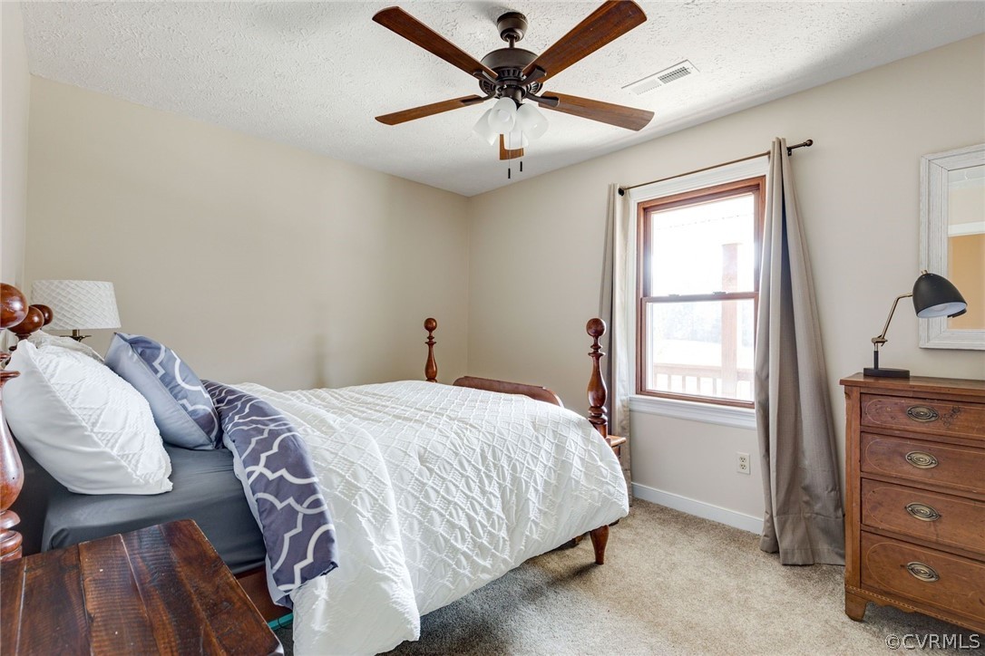 11054 Georgetown Road Mechanicsville, VA 23116 - Photo 19 of 50 a bedroom with a bed and a window