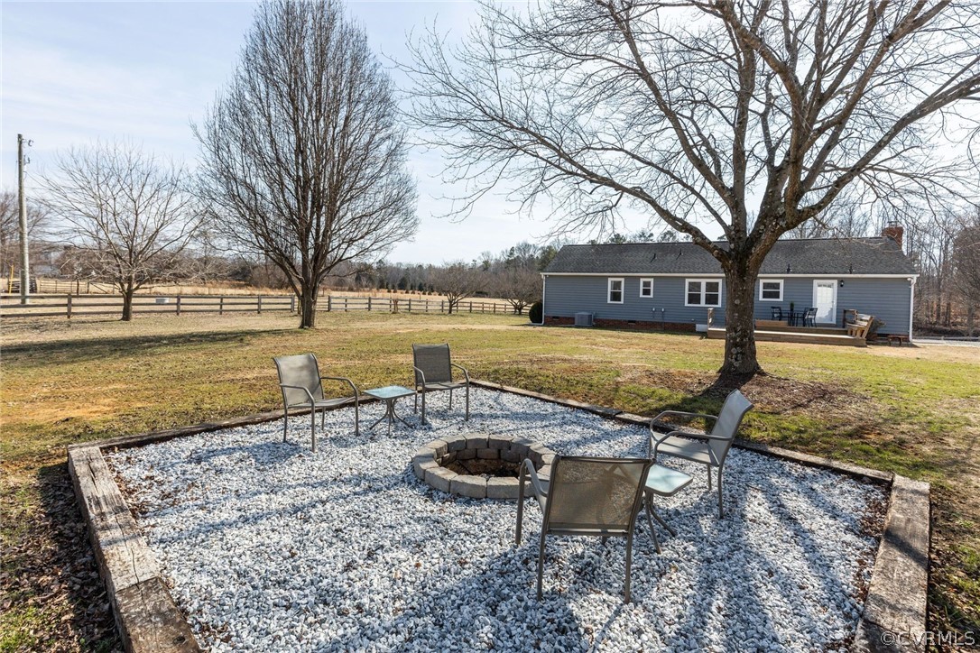11054 Georgetown Road Mechanicsville, VA 23116 - Photo 30 of 50 a view of a lake with a house with the garden and trees