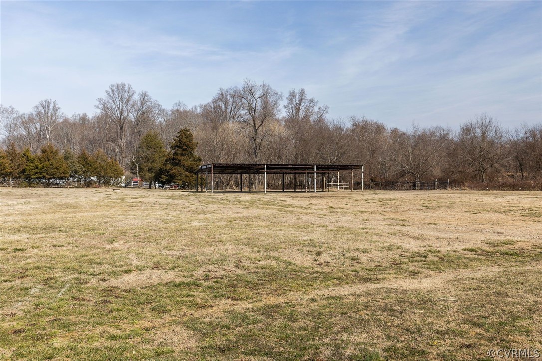 11054 Georgetown Road Mechanicsville, VA 23116 - Photo 33 of 50 a swimming pool with trees in the background