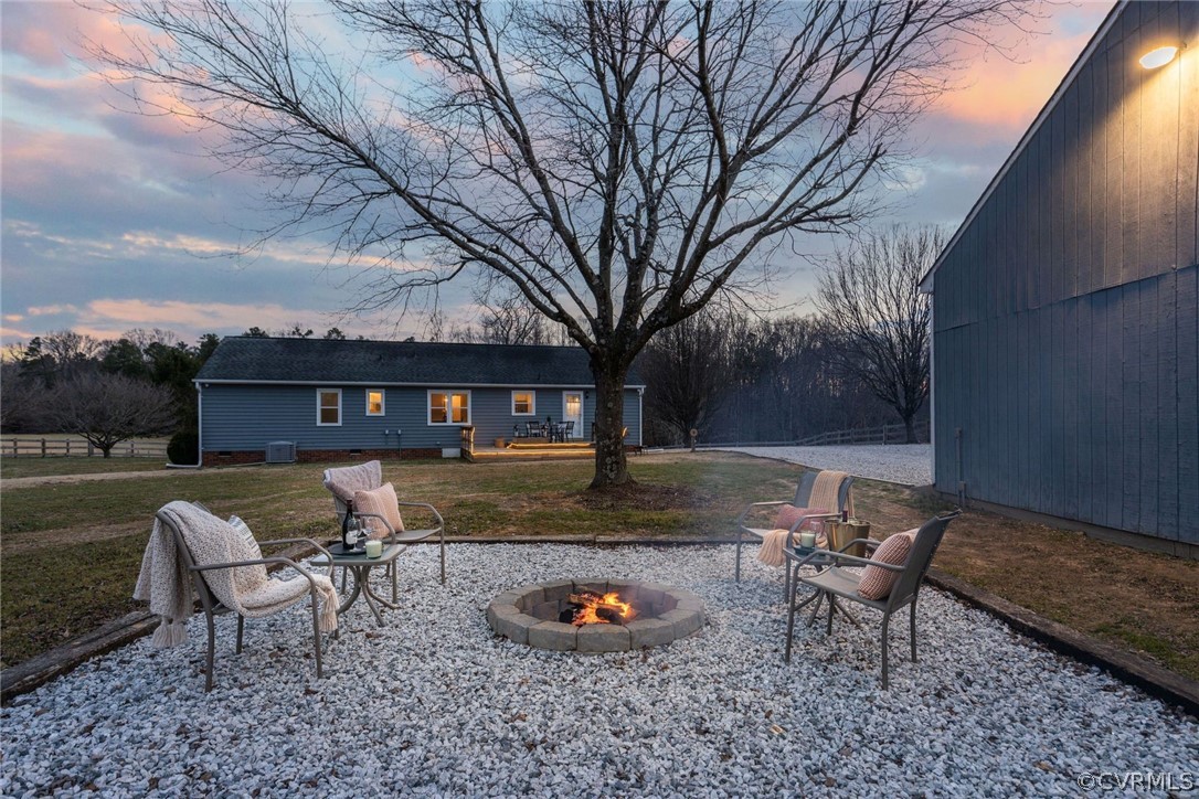 11054 Georgetown Road Mechanicsville, VA 23116 - Photo 36 of 50 a backyard of a house with table and chairs