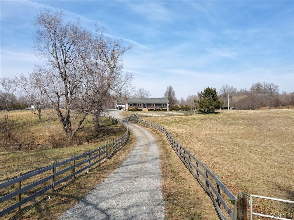 11054 Georgetown Road Mechanicsville, VA 23116 - Photo 4 of 50 a view of a pathway with a wrought fence