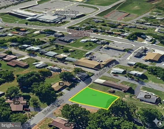 an aerial view of houses with outdoor space