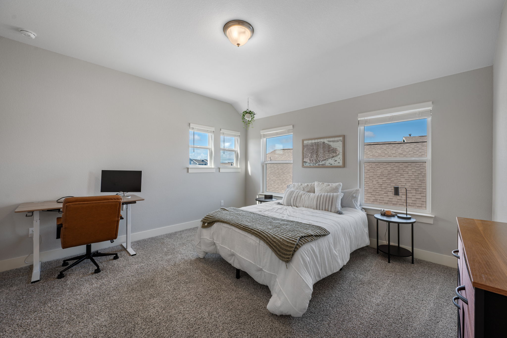 5409 Fox Wing Way Austin, TX 78747 - Photo 17 of 26 Sun-filled sleeping quarters featuring generous windows and plush carpeting for ultimate comfort.