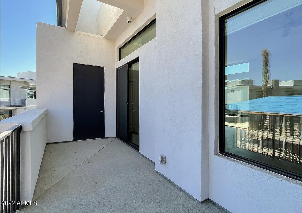 6060 East Baseline Road, Unit 101 Mesa, AZ 85206 - Photo 17 of 52 a view of a hallway with furniture and a window