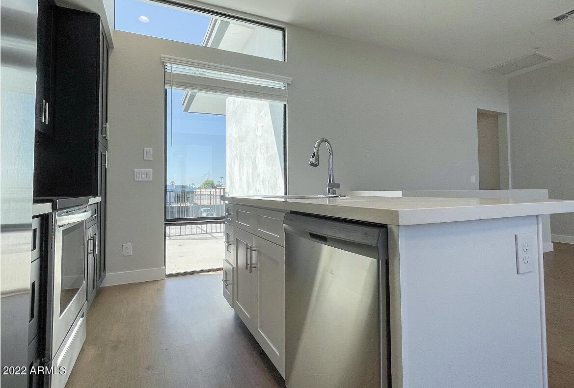 6060 East Baseline Road, Unit 101 Mesa, AZ 85206 - Photo 19 of 52 a bathroom with a sink a toilet and a mirror