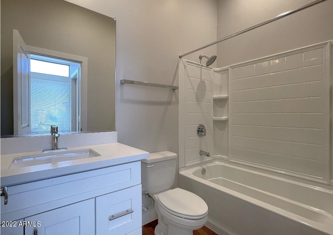 6060 East Baseline Road, Unit 101 Mesa, AZ 85206 - Photo 27 of 52 a bathroom with a sink a toilet and shower