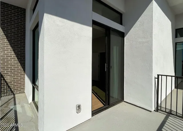 a room with walk in closet and a window