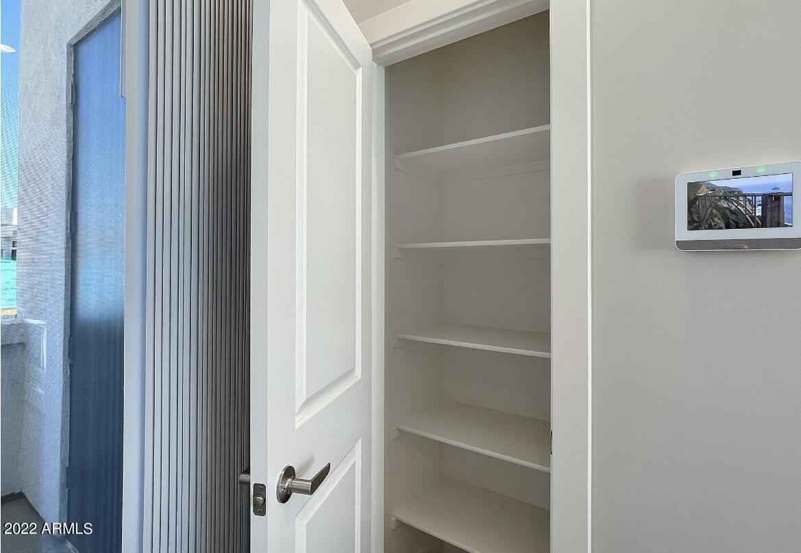 6060 East Baseline Road, Unit 101 Mesa, AZ 85206 - Photo 31 of 52 a room with walk in closet and a window