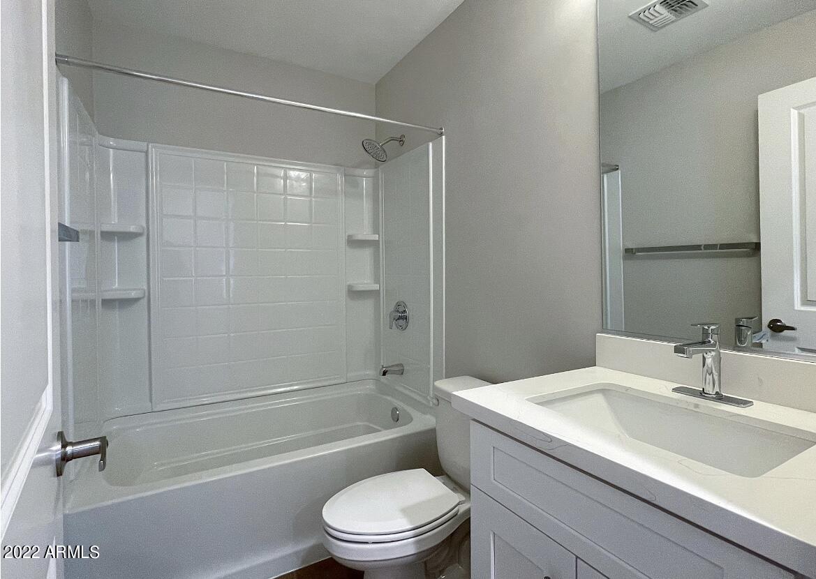 6060 East Baseline Road, Unit 101 Mesa, AZ 85206 - Photo 41 of 52 a bathroom with a sink a toilet and a bathtub
