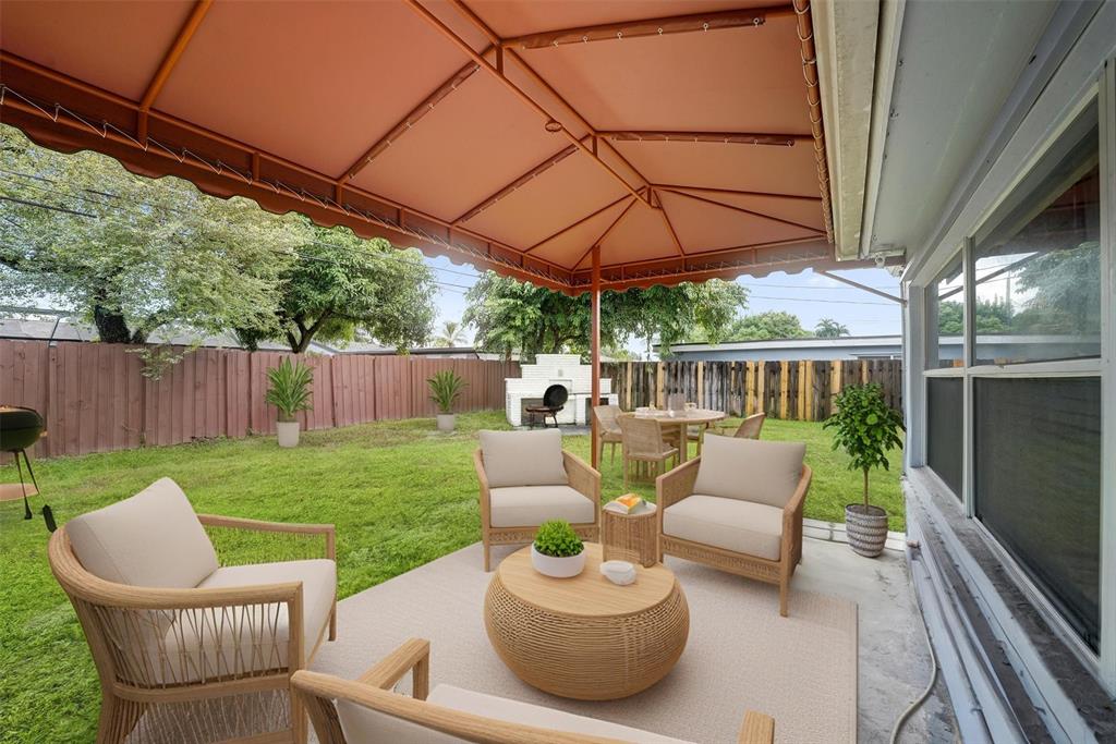 7021 Park Street Hollywood, FL 33024 - Photo 2 of 9 a view of a patio with couches chairs and a table