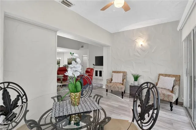 a view of hall way with furniture