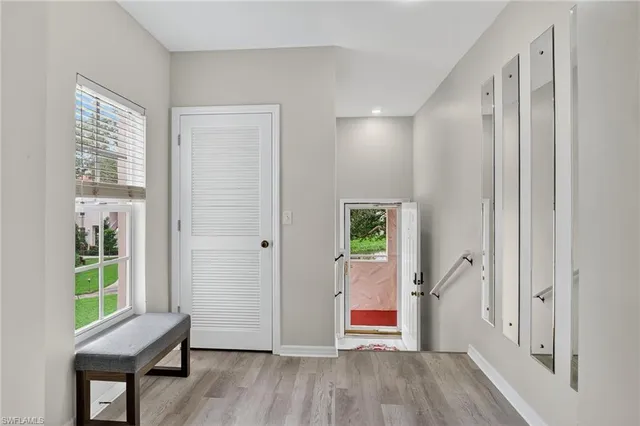 a view of room with window and wooden floor