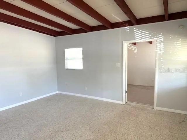 a view of a kitchen with a sink and a window