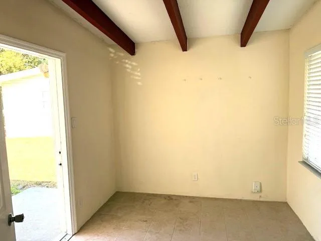a bath tub sitting next to a white toilet and a shower