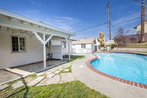 a view of a house with a swimming pool