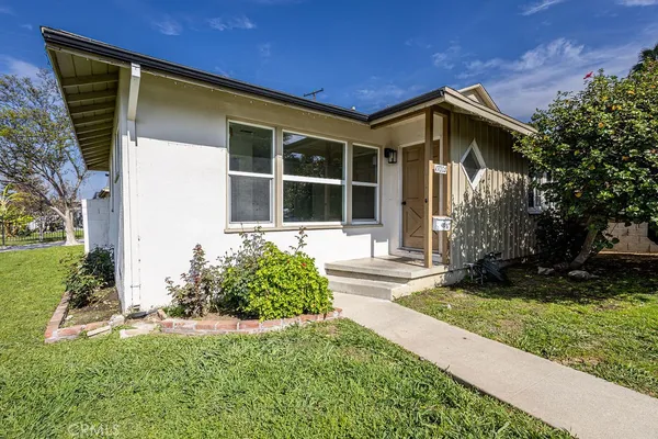 front view of a house with a yard