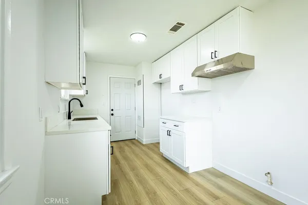 a view of a bathroom with a sink mirror and shower