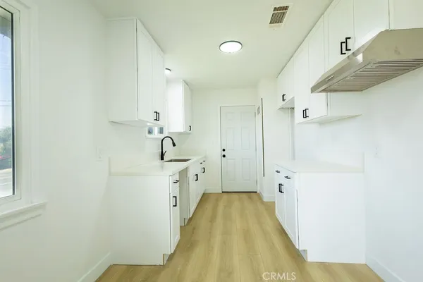 a bathroom with a sink a bathtub and shower