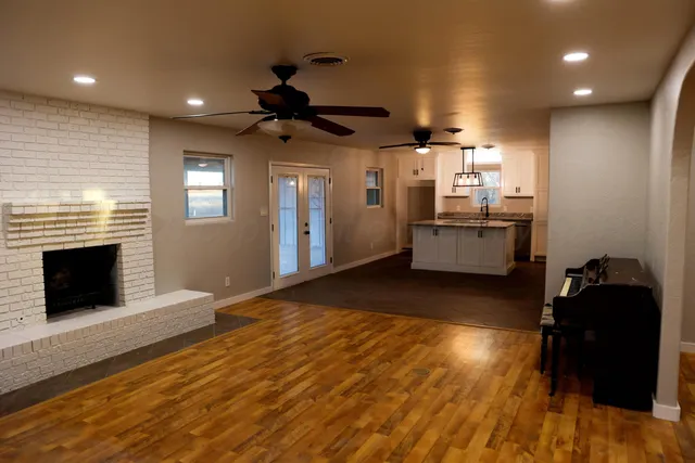 a kitchen with a refrigerator and a stove top oven