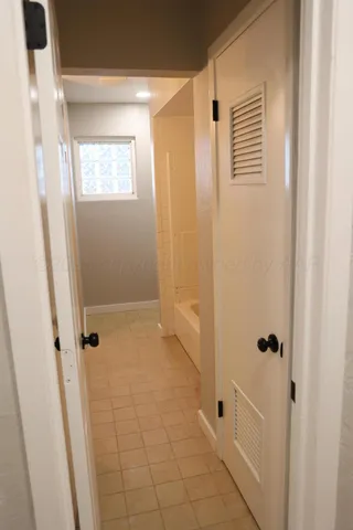 a bathroom with a granite countertop sink and vanity