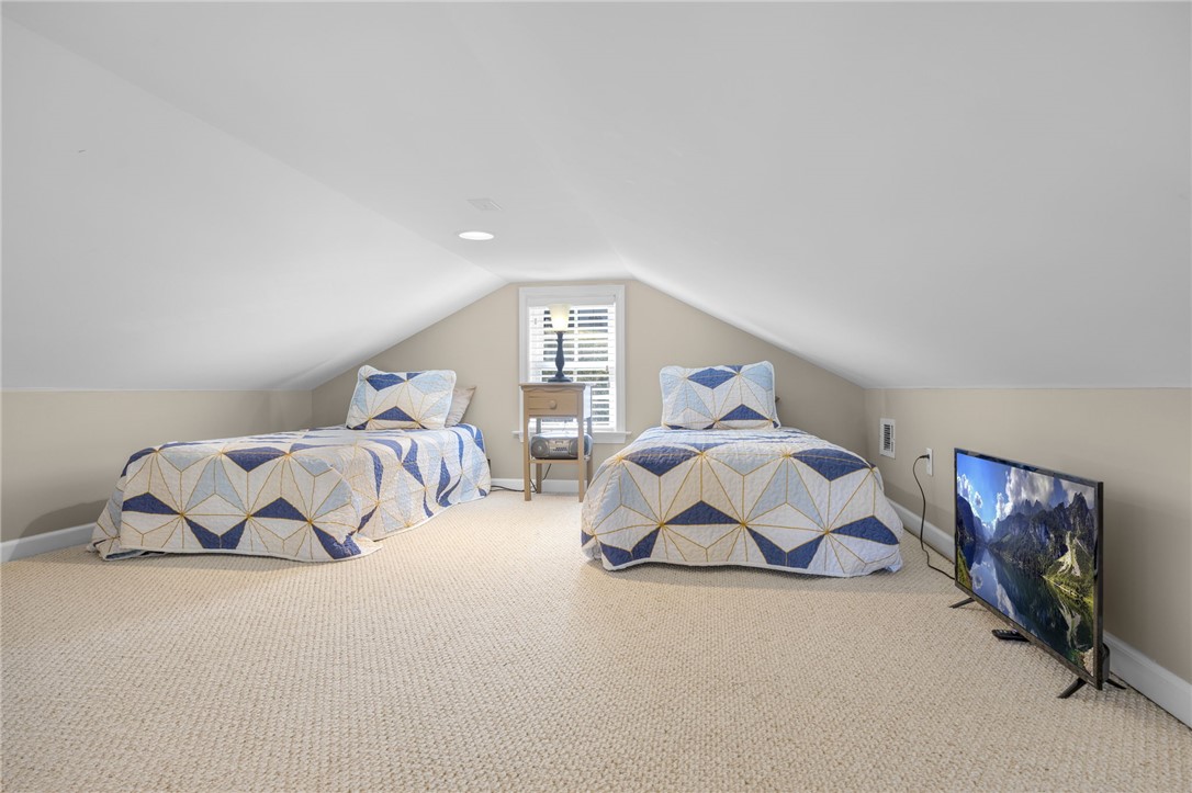 1230 Melton Road, Unit 93 West Union, SC 29696 - Photo 25 of 46 This cozy bedroom retreat offers comfortable accommodations with sloped ceilings and ample natural light.