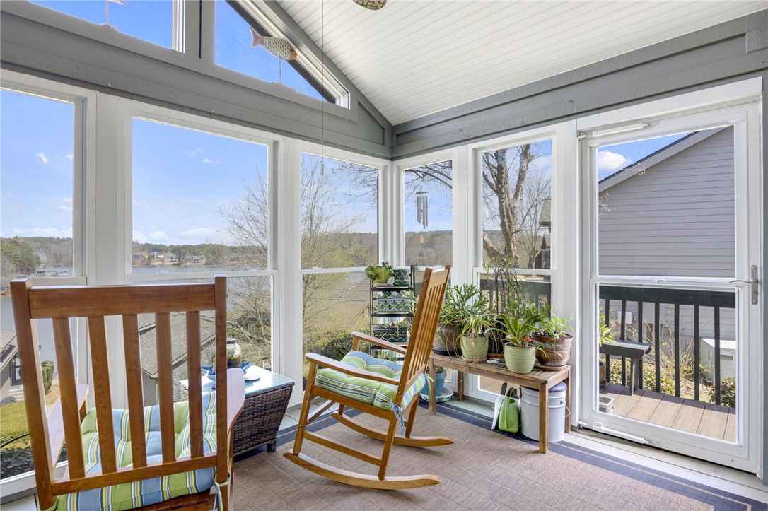 1230 Melton Road, Unit 93 West Union, SC 29696 - Photo 3 of 45 Enjoy tranquil lake views from this sun-drenched enclosed porch.