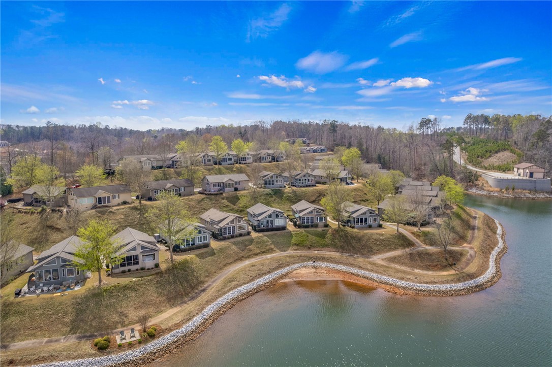 1230 Melton Road, Unit 93 West Union, SC 29696 - Photo 36 of 46 This captivating aerial view showcases a vibrant community nestled along a picturesque lake.