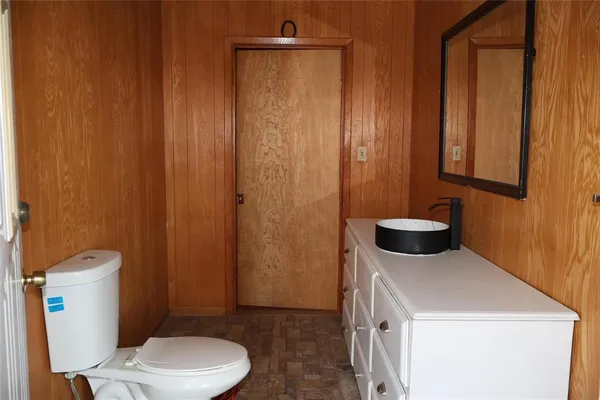 a bathroom with a toilet and a sink