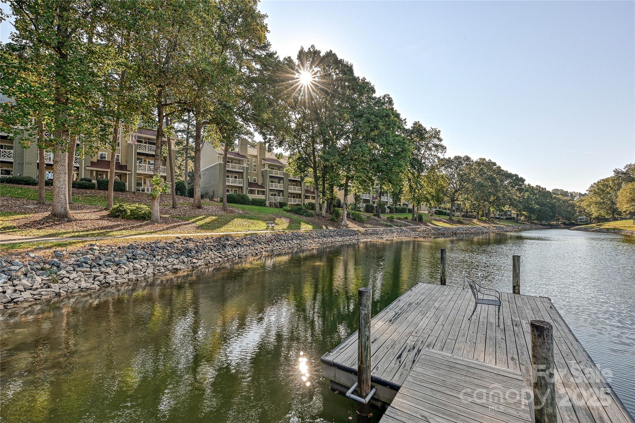 a lake view with a wooden bridge