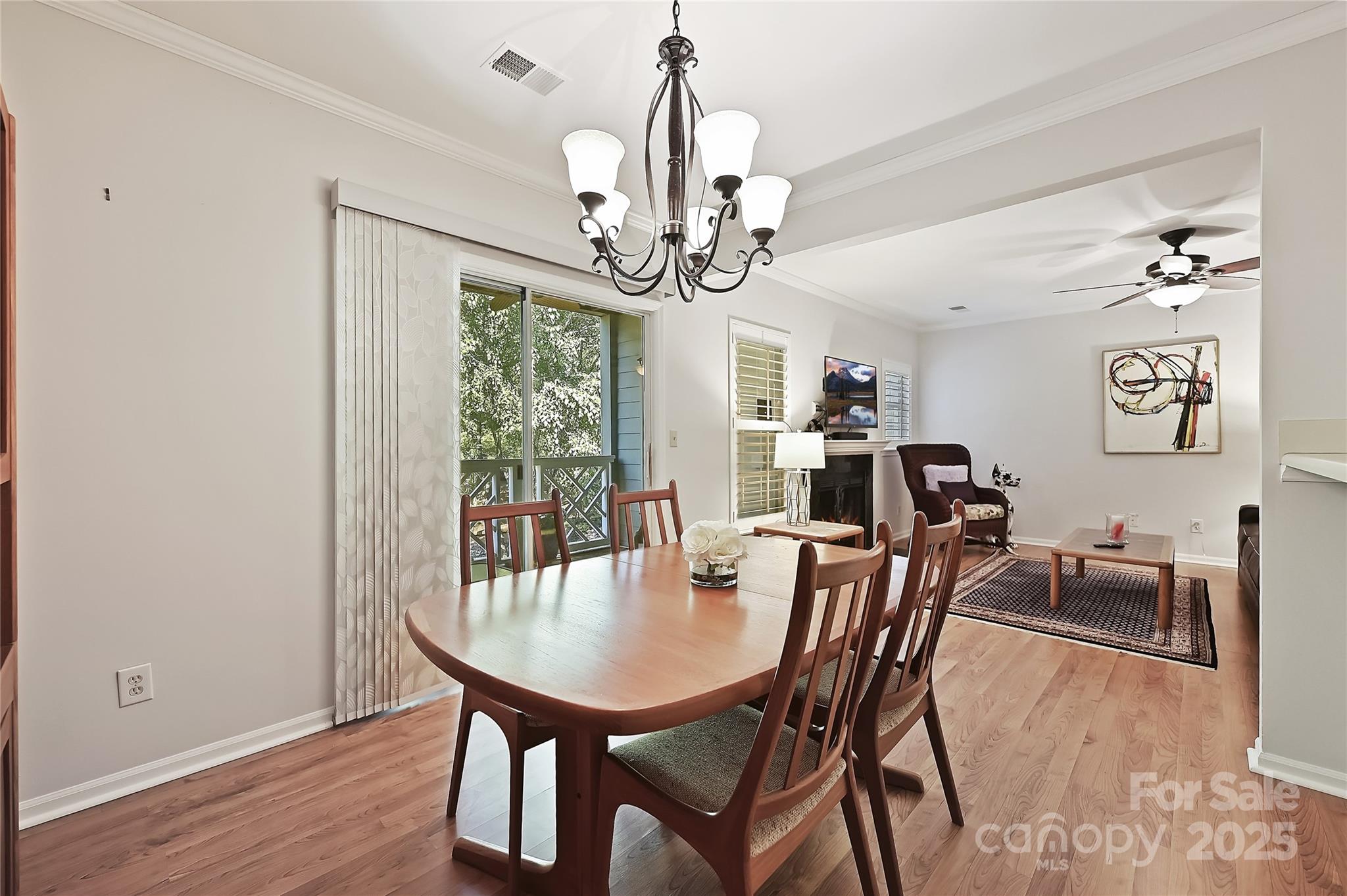 19901 Henderson Road, Unit C Cornelius, NC 28031 - Photo 19 of 42 a view of a dining room with furniture window and wooden floor