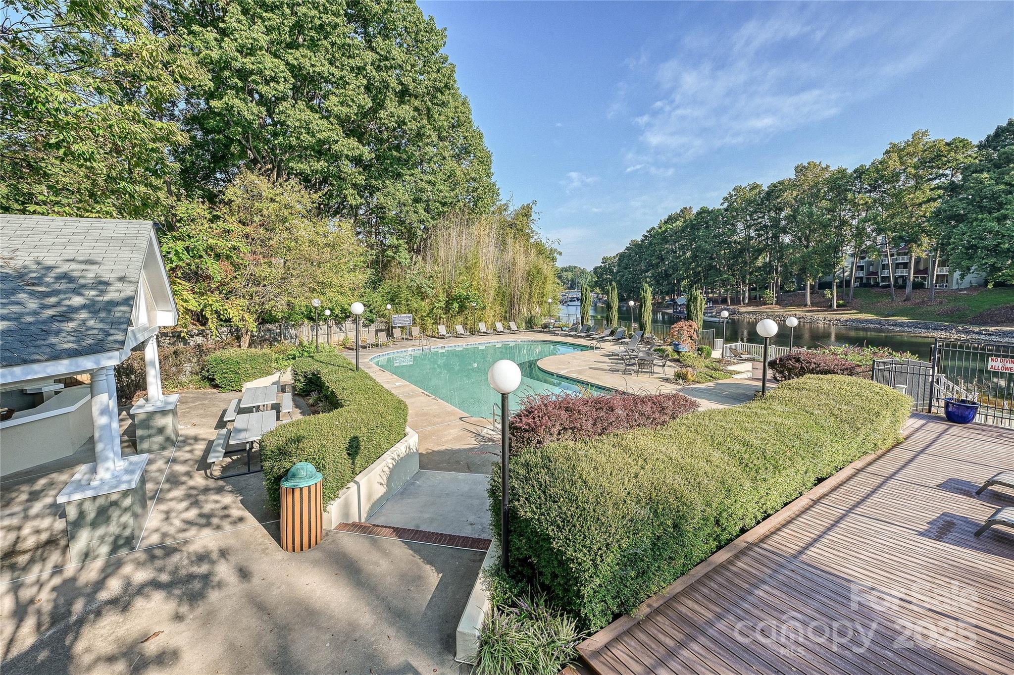 19901 Henderson Road, Unit C Cornelius, NC 28031 - Photo 31 of 42 a view of a swimming pool with a patio