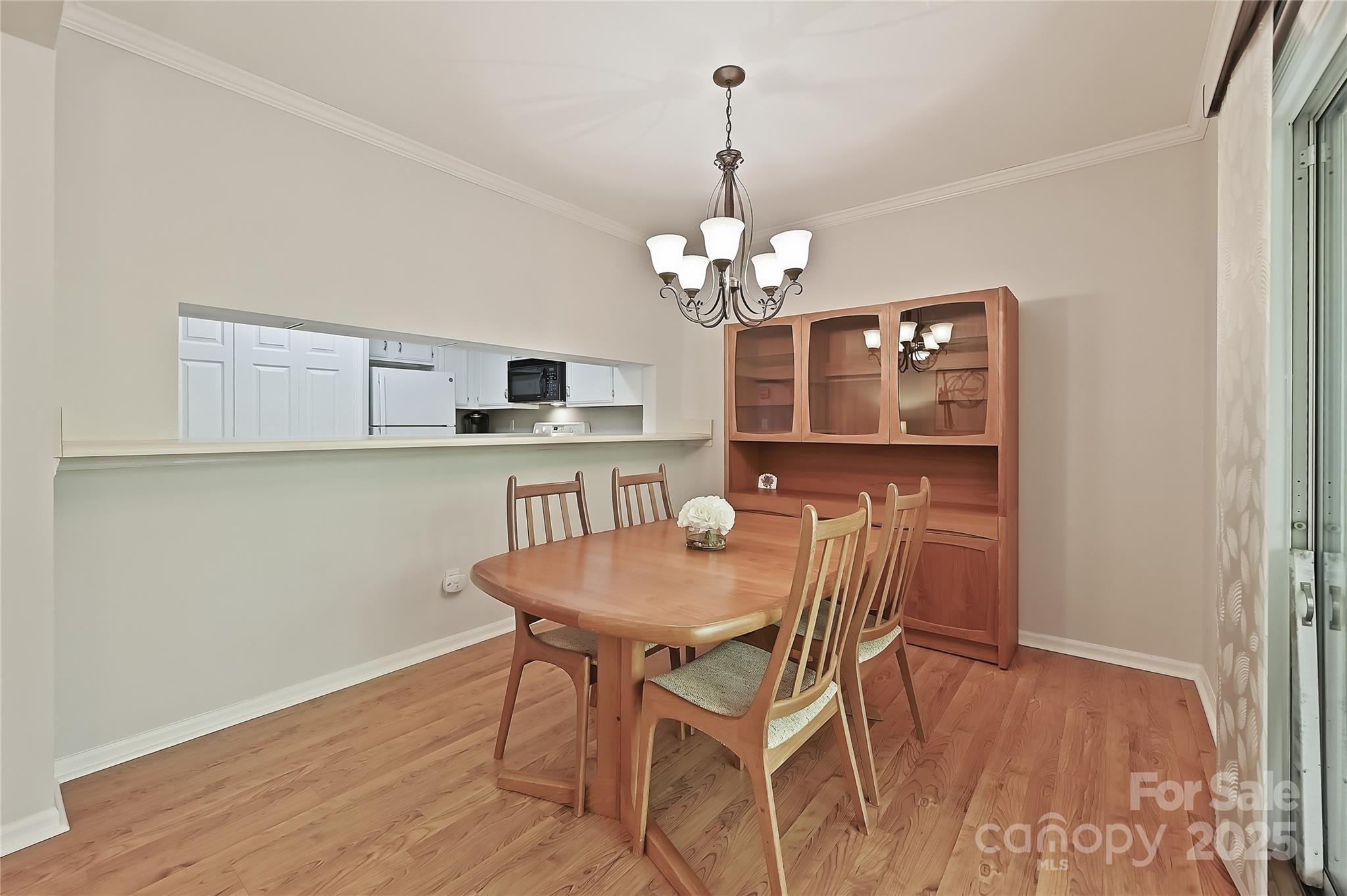 19901 Henderson Road, Unit C Cornelius, NC 28031 - Photo 10 of 42 a view of a dining room with furniture and wooden floor