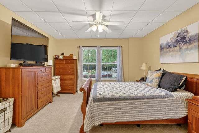 8179 Pineview Court Villa Rica, GA 30180 - Photo 21 of 41 a bedroom with a bed and flat screen tv