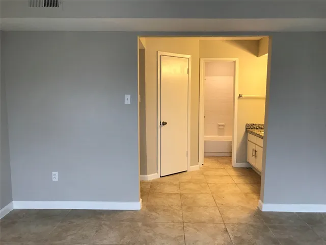 a view of a bathroom with a tub and toilet