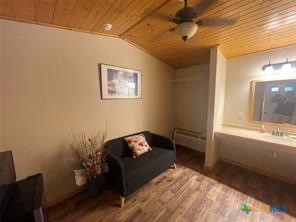 1104 Rorem Avenue Palacios, TX 77465 - Photo 13 of 17 a bedroom with a bed and a window