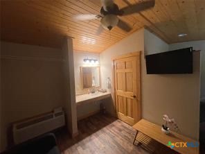 1104 Rorem Avenue Palacios, TX 77465 - Photo 15 of 17 a room with a chair and a flat screen tv
