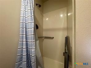 1104 Rorem Avenue Palacios, TX 77465 - Photo 7 of 17 a bathroom with a shower