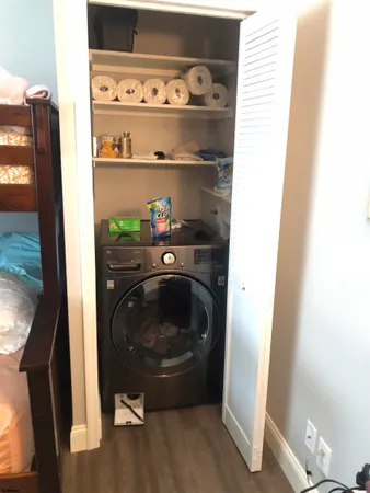 a utility room with washing machine