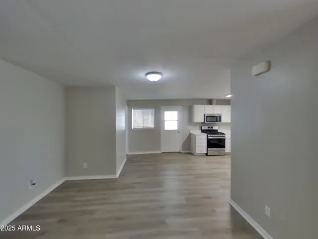 a view of an empty room with a window