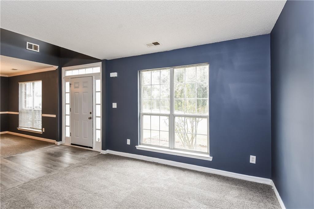 2716 River Tree Drive Decatur, GA 30034 - Photo 13 of 27 a view of an empty room with glass door and windows