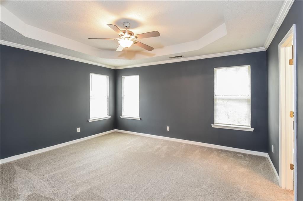 2716 River Tree Drive Decatur, GA 30034 - Photo 16 of 27 a view of an empty room with chandelier fan and fire place
