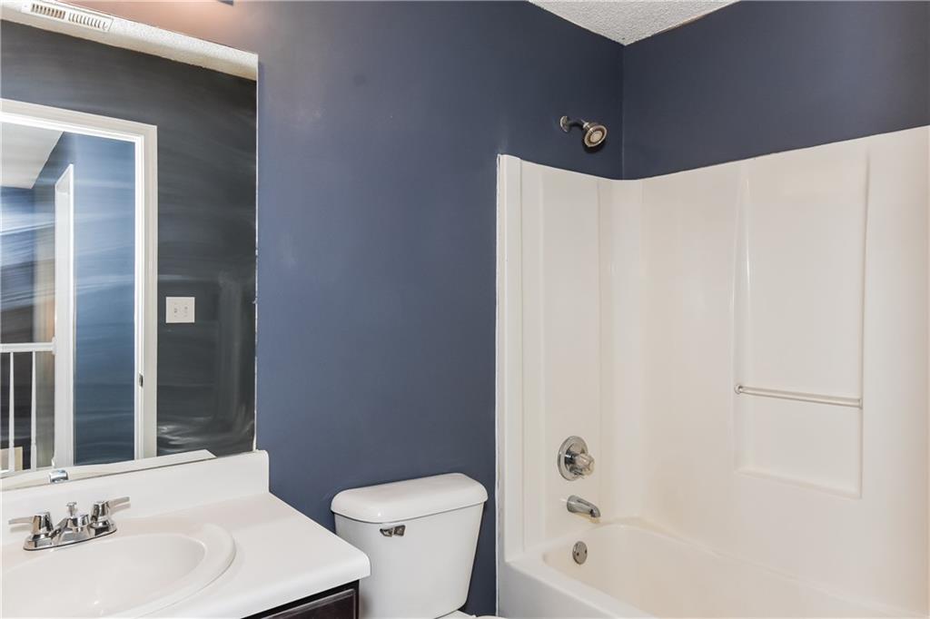 2716 River Tree Drive Decatur, GA 30034 - Photo 25 of 27 a bathroom with a bathtub shower sink vanity and toilet