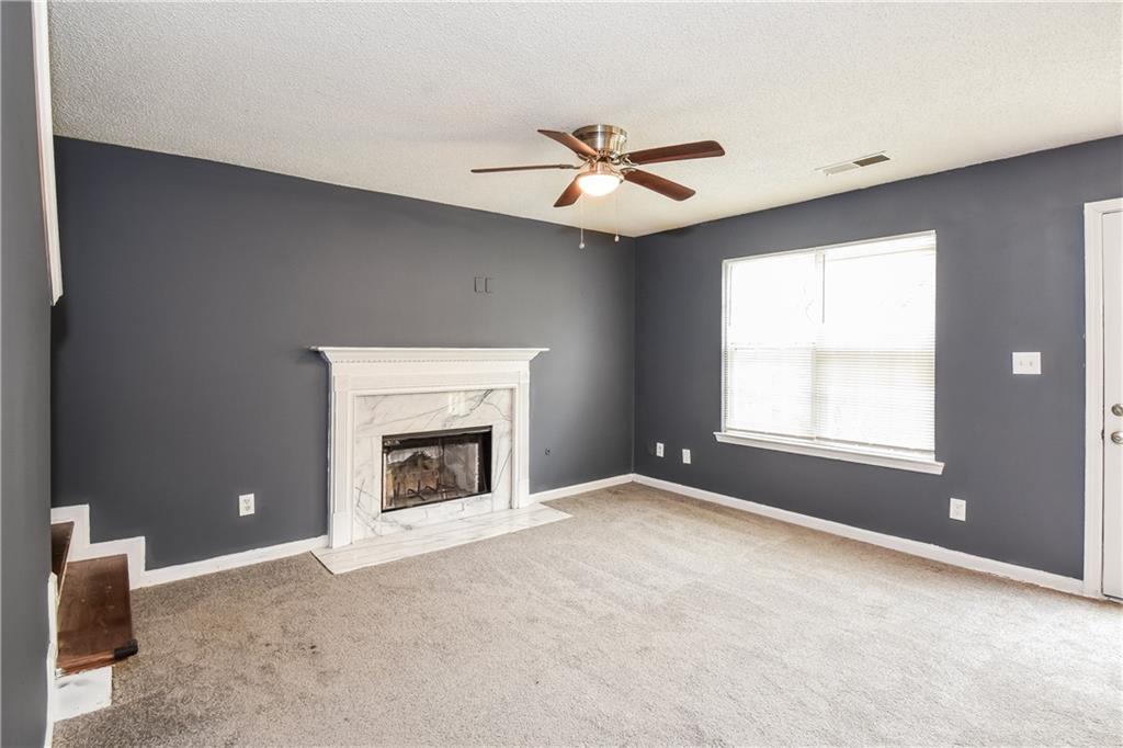2716 River Tree Drive Decatur, GA 30034 - Photo 6 of 27 a view of an empty room with window and fireplace