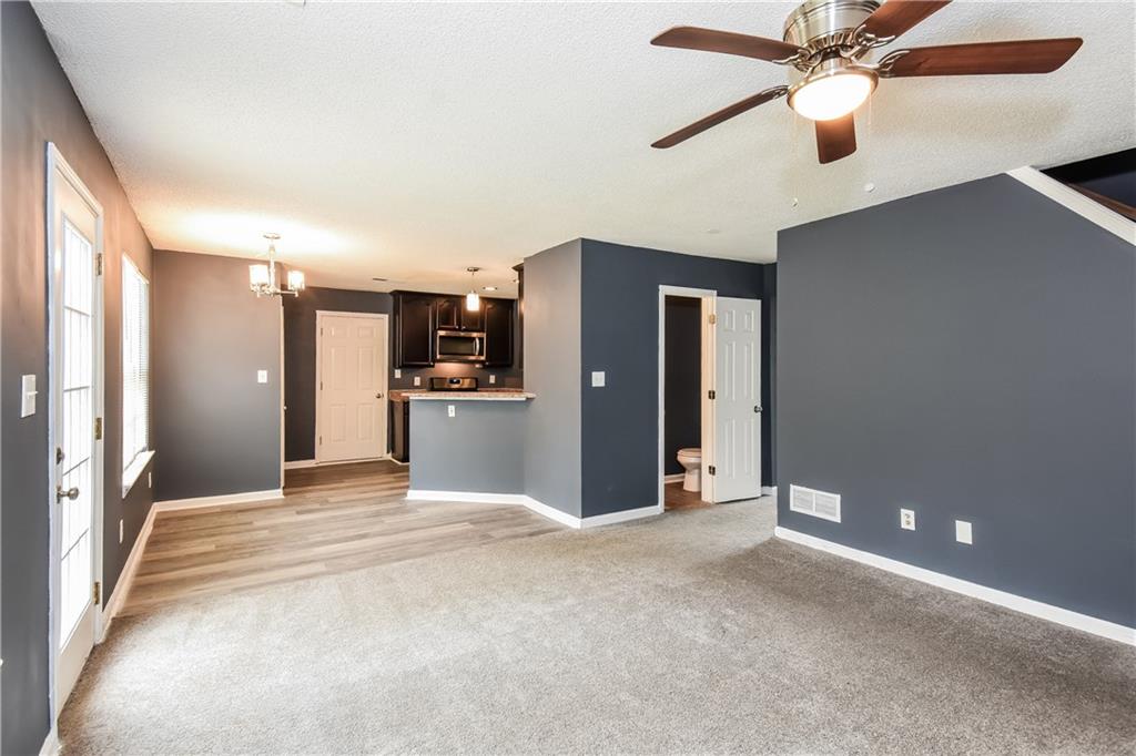 2716 River Tree Drive Decatur, GA 30034 - Photo 7 of 27 a view of a kitchen with a refrigerator and a ceiling fan