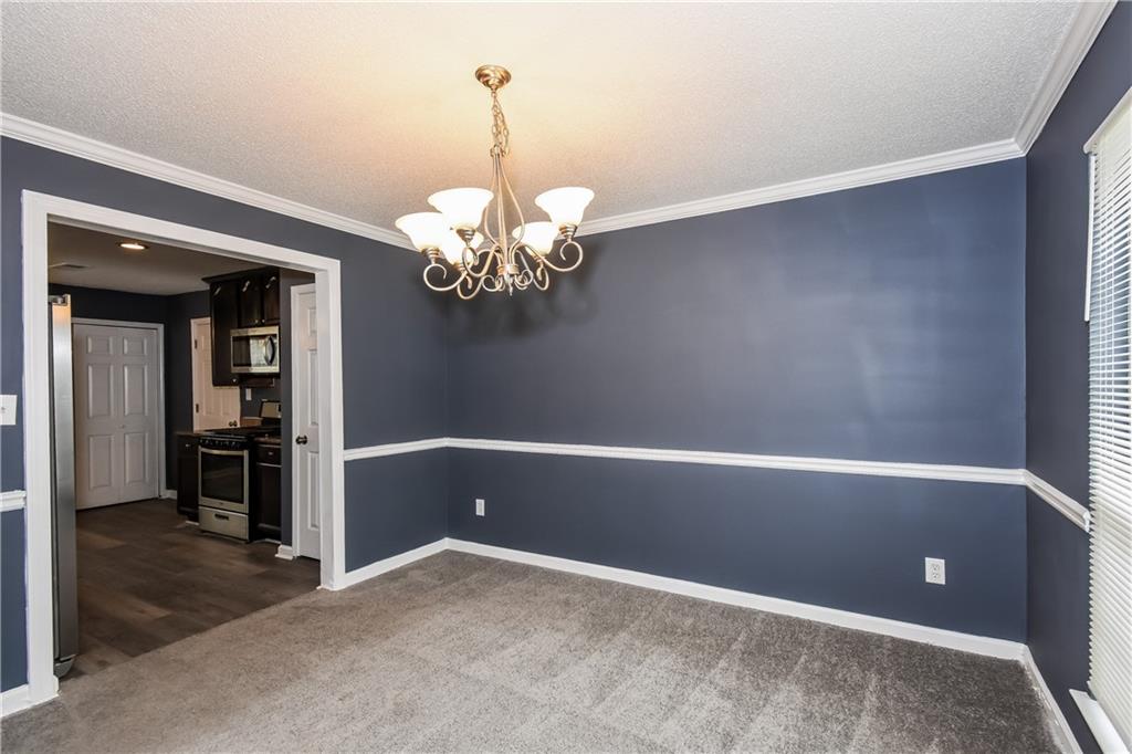 2716 River Tree Drive Decatur, GA 30034 - Photo 10 of 27 a view of a chandelier in big room and chandelier
