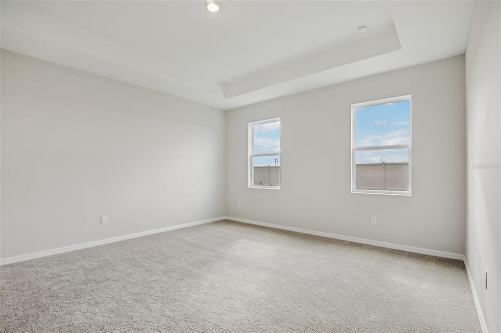 10167 Hidden Hammock Loop Parrish, FL 34221 - Photo 21 of 42 a view of an empty room with a window