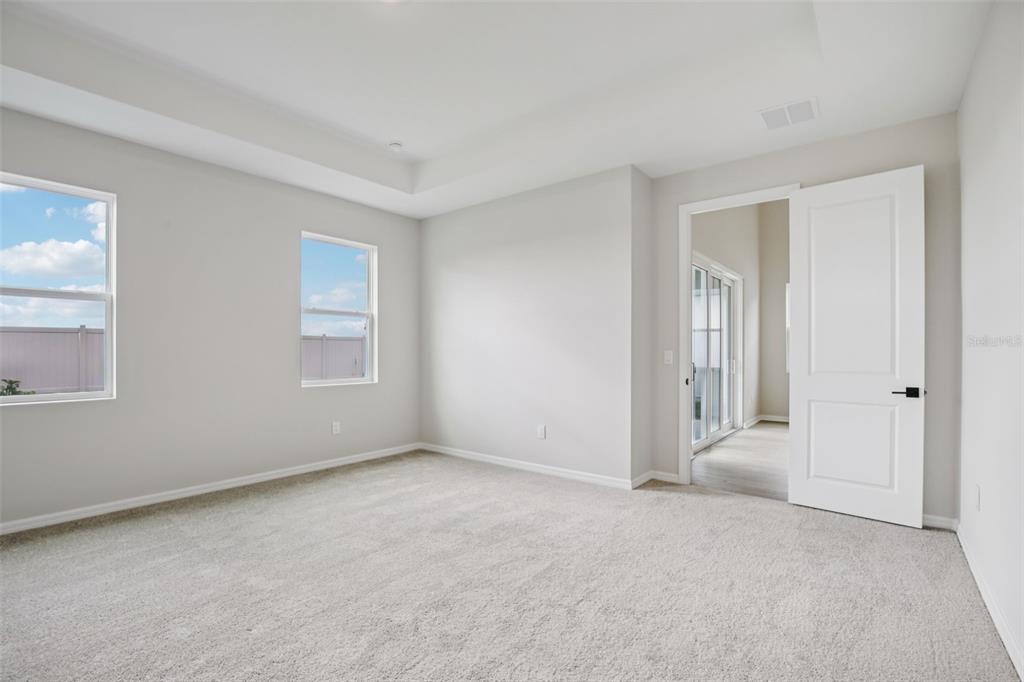 10167 Hidden Hammock Loop Parrish, FL 34221 - Photo 24 of 42 a view of an empty room and window