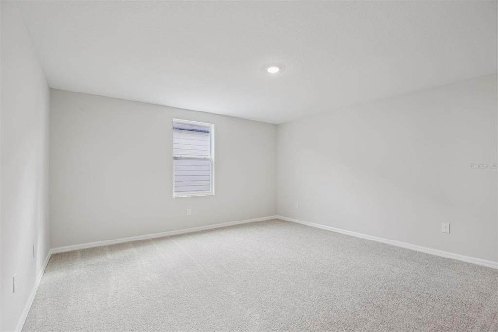 10167 Hidden Hammock Loop Parrish, FL 34221 - Photo 27 of 42 a view of an empty room with a window