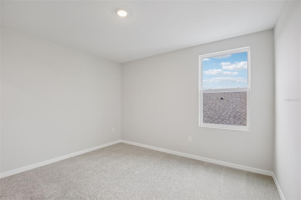 10167 Hidden Hammock Loop Parrish, FL 34221 - Photo 29 of 42 an empty room with a window